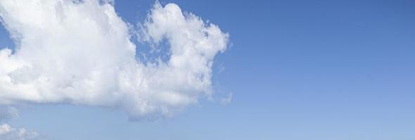 Image of a partly cloudy and partly clear sky during the day photo