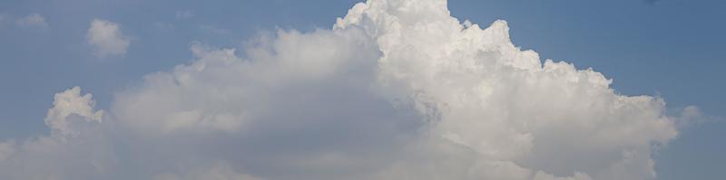 Image of a partly cloudy and partly clear sky during the day photo