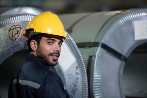 Portrait of a heavy equipment male engineer from a huge industry photo