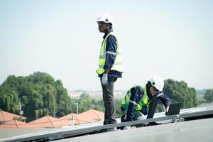 Engineer in charge of solar panel installation The installation of solar energy photo