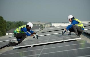 Engineer in charge of solar panel installation The installation of solar energy photo