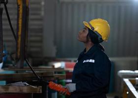 Female technicians Inspecting and testing the operation of lifting cranes photo