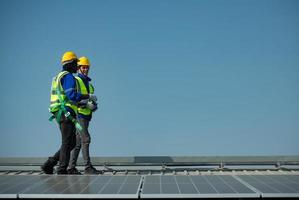 Engineer in charge of solar panel installation The installation of solar energy photo