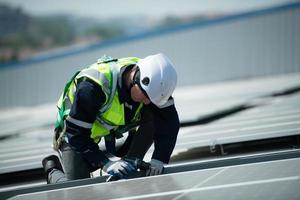 Engineer in charge of solar panel installation The installation of solar energy photo