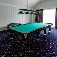 Billiard table in the hotel, sports game for relaxation. photo