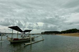 Photo of traditional boats on the coast.