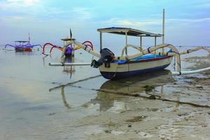 View of a fishing boat on the beach. photo