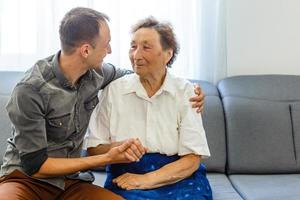 Grandson visiting grandmother at home in quarantine photo