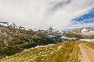 Amazing view of touristic trail near the Matterhorn in the Swiss Alps. photo