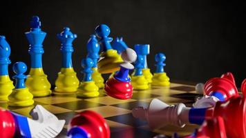 Russia's aggression against Ukraine. Chess in the colors of flags. 3D rendering illustration. photo