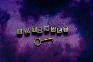 internet wording with metal letters and key as business concept photo