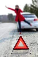 Woman waits for roadside assistance photo