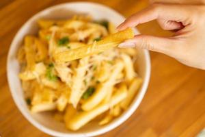 French fries. potato chips. Bowl with fresh cooked french fries potato chips. appetizing. copy space for text. photo