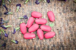 Pink or red kidney beans for dry in the threshing basket photo