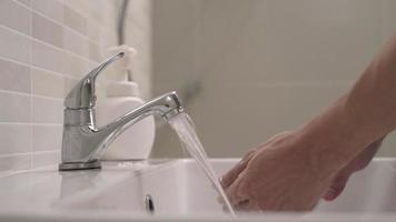 clean is method to prevent germs concept. man washing his hands after handling an object to prevent infection with the virus. Washing your hands frequently reduces the risk of contracting the virus. video