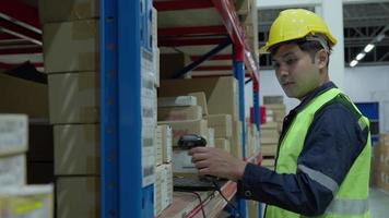 Warehouse worker scan box goods in inventory and check stock product. Transport logistic business shipping and delivery to customers through a freight forwarding company. video