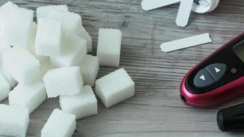 Sugar cubes on the table. Diabetes testing video