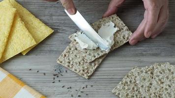 Crispbread with creamy cheese on the table video