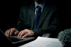 Lawyer working on legal cases Lawyer or secretary writes brief contracts, career and business documents in court.Businessperson using laptop. photo