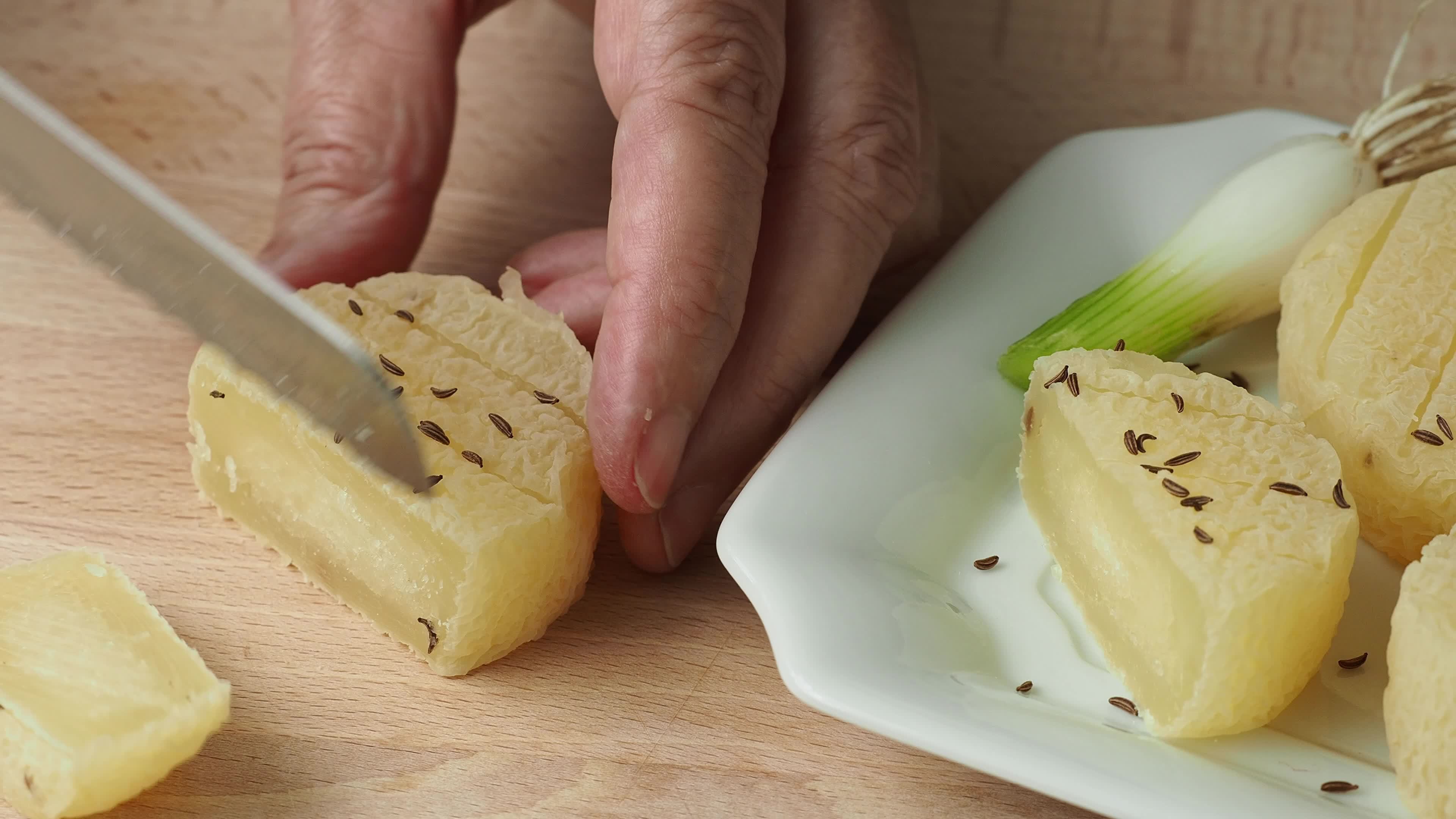 Hands cutting traditional Czech cheese. Stinky cheese. Aromatic 