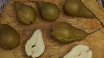 Wooden board with sweet ripe pears. video