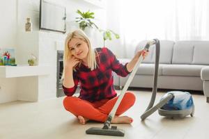 woman cleans the floor of the house photo