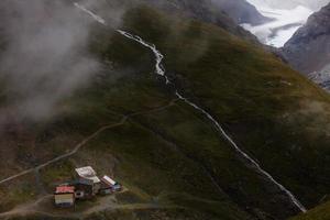 Panorama of cloud layer from mountain top over Swiss alps photo