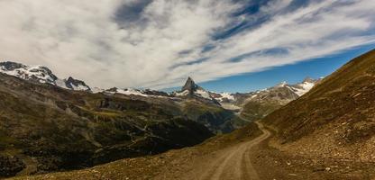 Amazing view of touristic trail near the Matterhorn in the Swiss Alps. photo