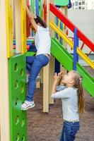 two little girls on the playground photo