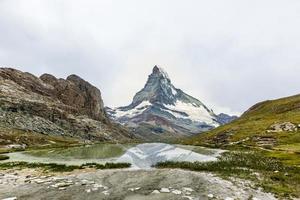 Panorama of cloud layer from mountain top over Swiss alps photo