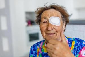 elderly woman with one eye surgery photo