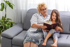 grandmother and granddaughter read photo