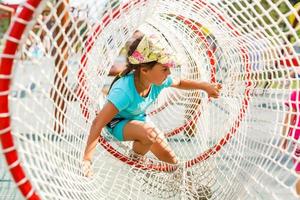 Active little girl on playground photo