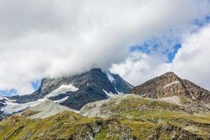 Panorama of cloud layer from mountain top over Swiss alps photo