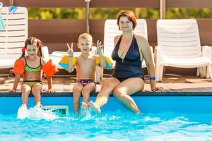 boy screaming in the swimming pool photo