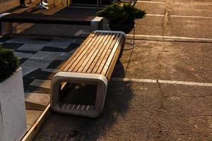 Modern benches in the city square on a sunny day. City improvement, urban planning, public spaces. photo