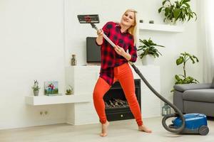 woman cleans the floor of the house photo