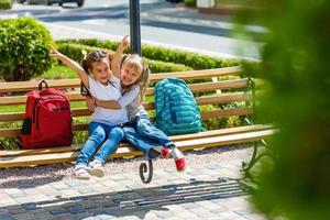 happy little girls with classmates having fun at the School photo