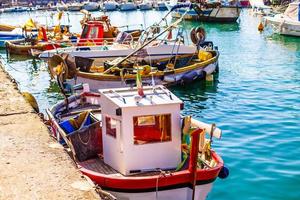 Fishing Boats in Liguria Italy. Small fishing boats with fishing equipment docked in the port - Lerici, La Spezia, Liguria, Italy photo