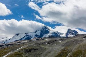 Panorama of cloud layer from mountain top over Swiss alps photo