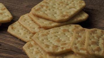 Delicious dry crackers on a wooden table. Biscuits salty crackers.