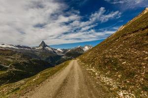 Amazing view of touristic trail near the Matterhorn in the Swiss Alps. photo