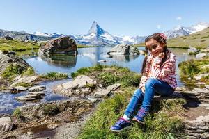 Amazing view of touristic trail near the Matterhorn in the Swiss Alps. photo