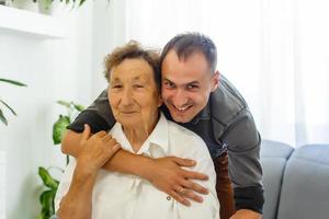 Grandson visiting grandmother at home in quarantine photo