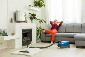 woman cleans the floor of the house photo