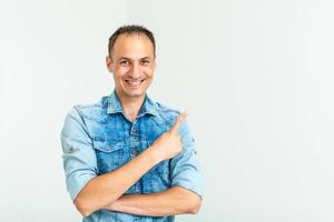 Handsome welcoming man smiling - isolated over a white background photo