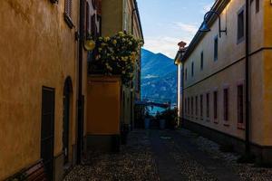 Narrow street of town at the lake Como, Italy photo