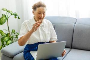 Portrait of a senior woman working at computer photo