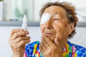 elderly woman with one eye surgery photo