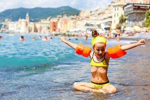 little girl on the beach in italy, coast in Italy photo